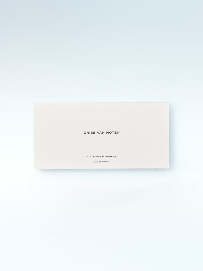 Dries Van Noten perfume packaging on a light gray background