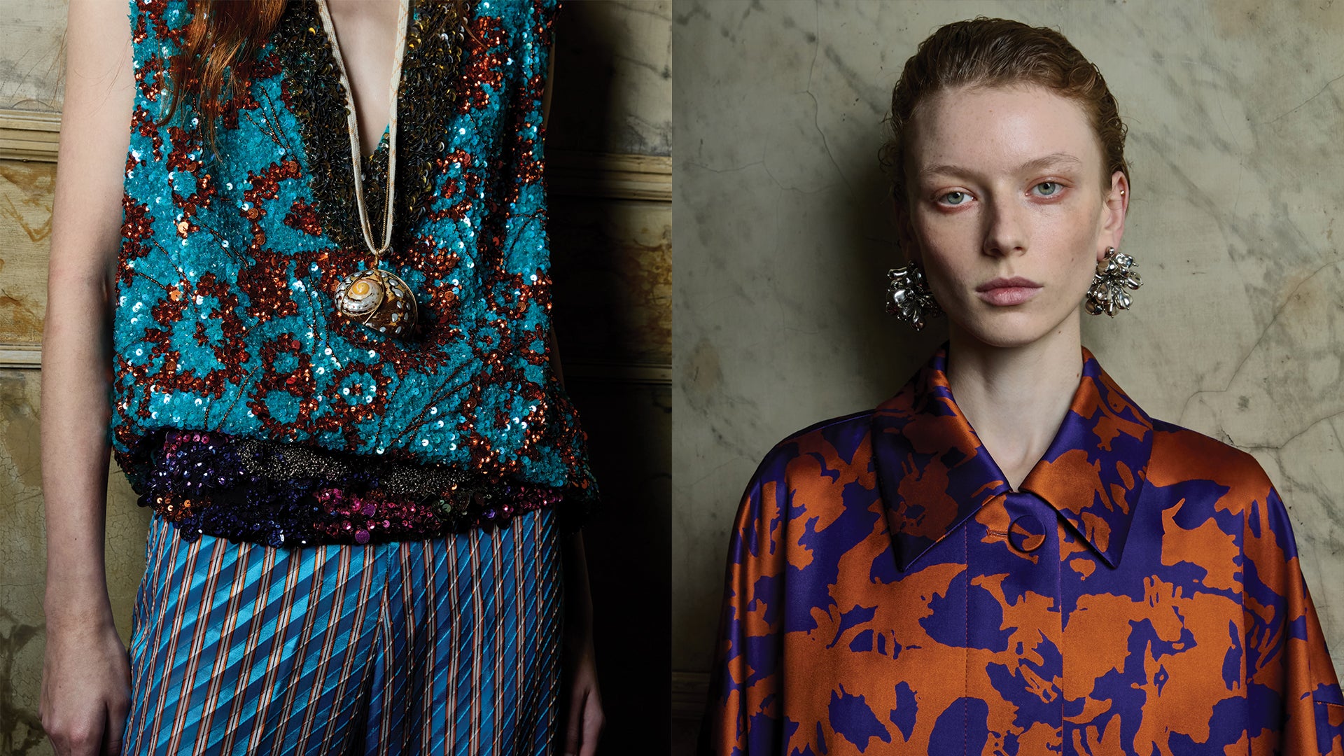 Two women wearing patterned outfits with a decorative background