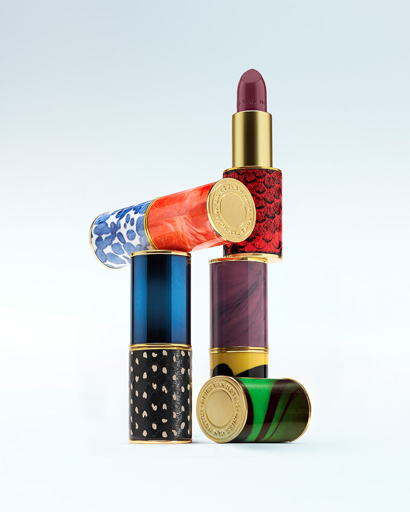 Colorful lipstick with decorative casing on a light gray background - Dries Van Noten