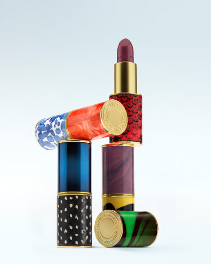 Colorful lipstick with patterned design on a light gray background - Dries Van Noten