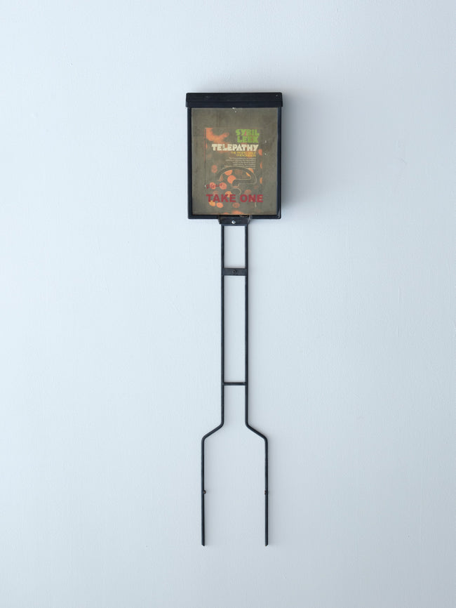 Metal sign holder with a digital display on a white background