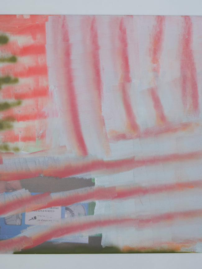 Close-up of a colorful striped fabric with pink, white, and green patterns.