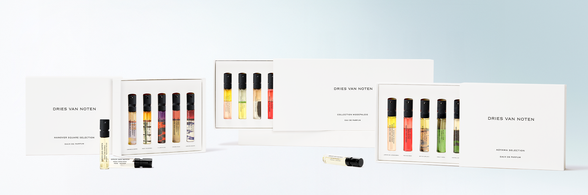 Set of lip gloss samples with packaging on a light blue background - Dries Van Noten