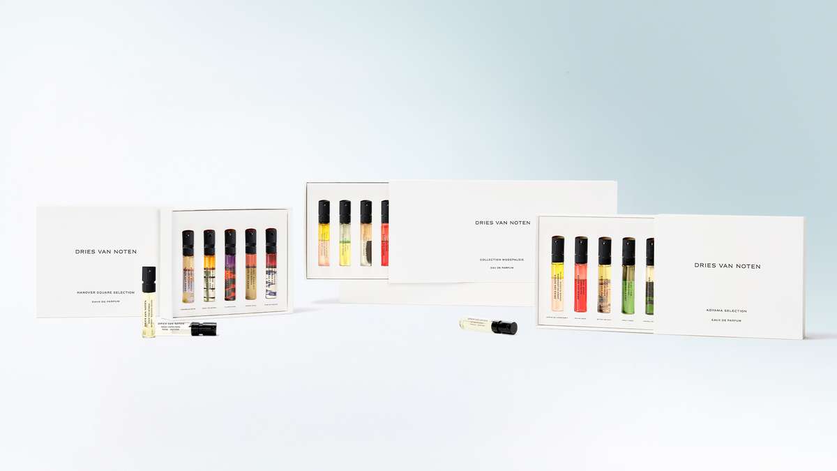 Set of lip gloss samples with packaging on a light blue background - Dries Van Noten