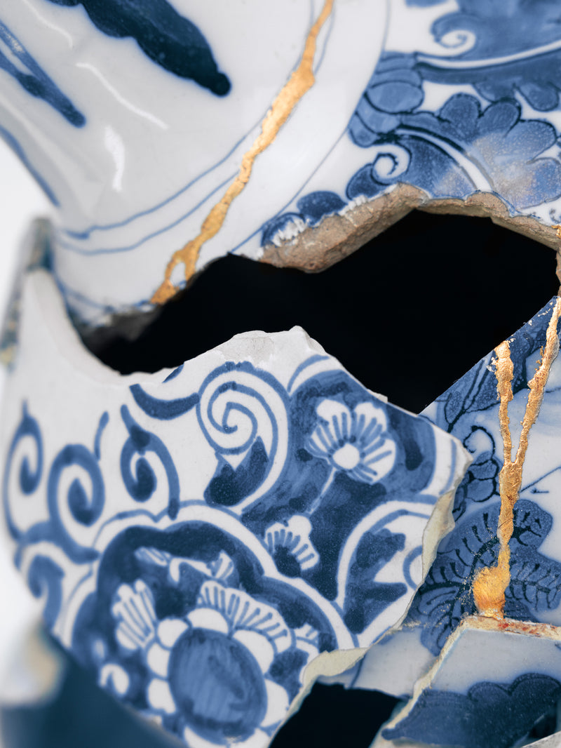 Close-up of a blue and white ceramic vase with intricate patterns - Dries Van Noten