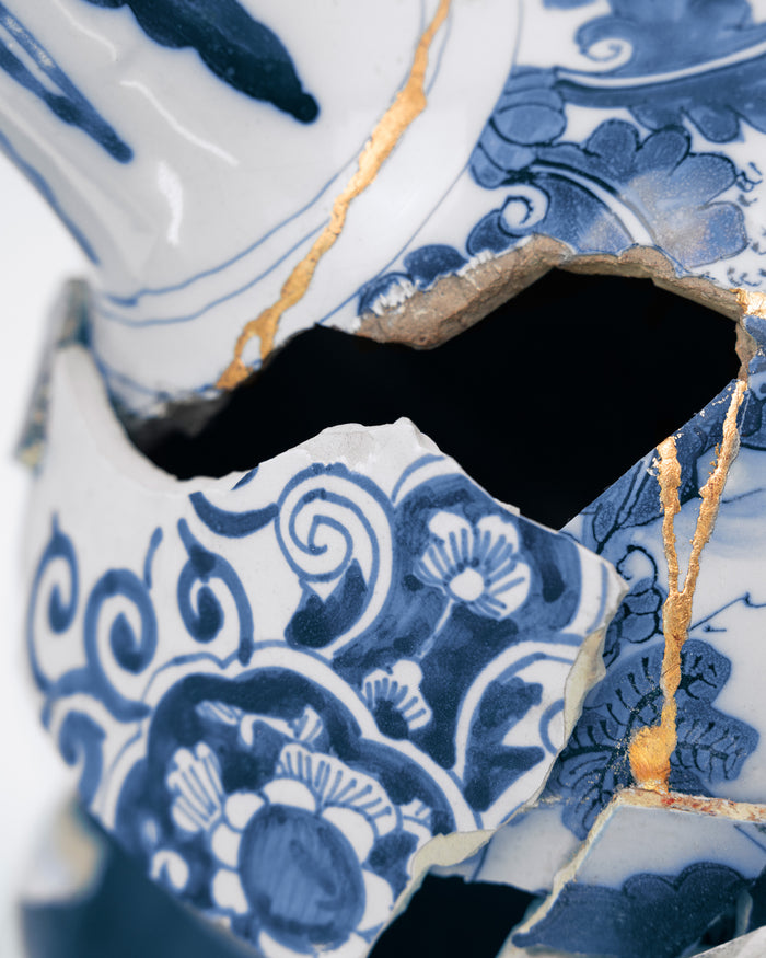 Close-up of a blue and white ceramic vase with intricate patterns - Dries Van Noten