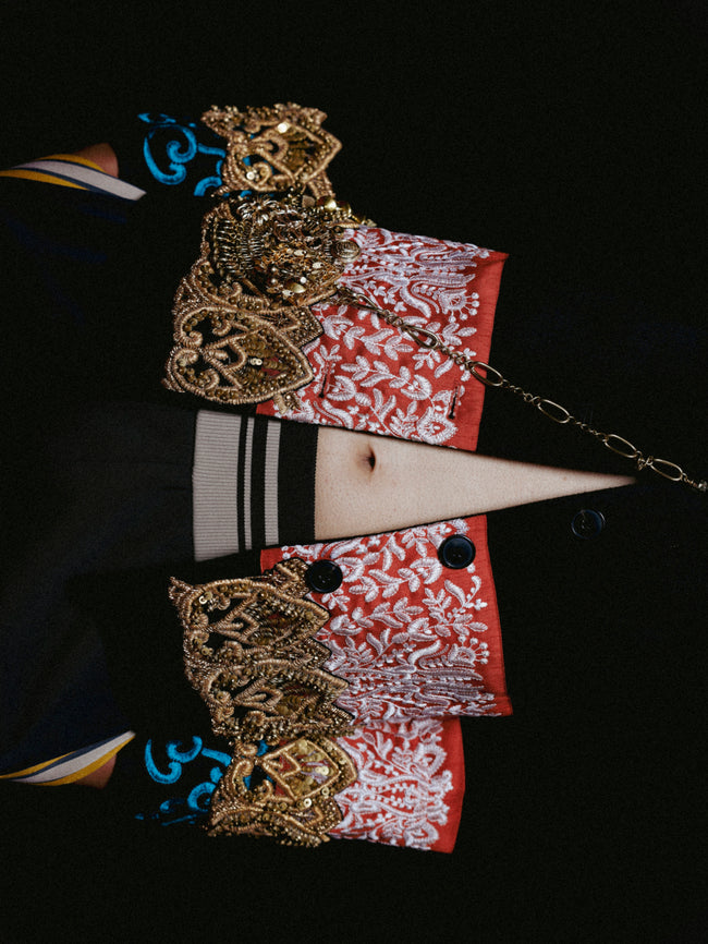 Decorative headpiece with intricate designs on a black background