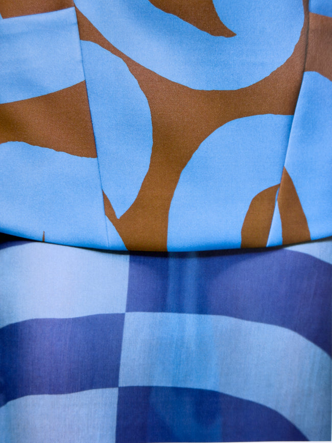 Close-up of fabric with blue and brown abstract pattern