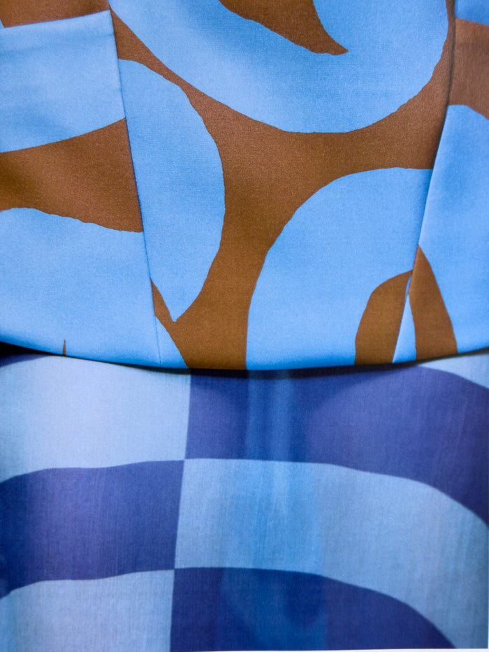 Close-up of fabric with blue and brown abstract pattern