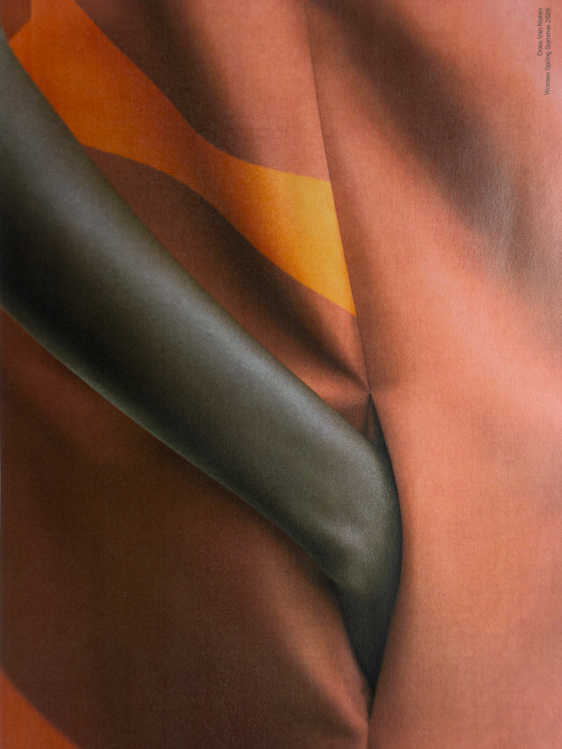 Close-up of fabric with brown, green, and orange colors