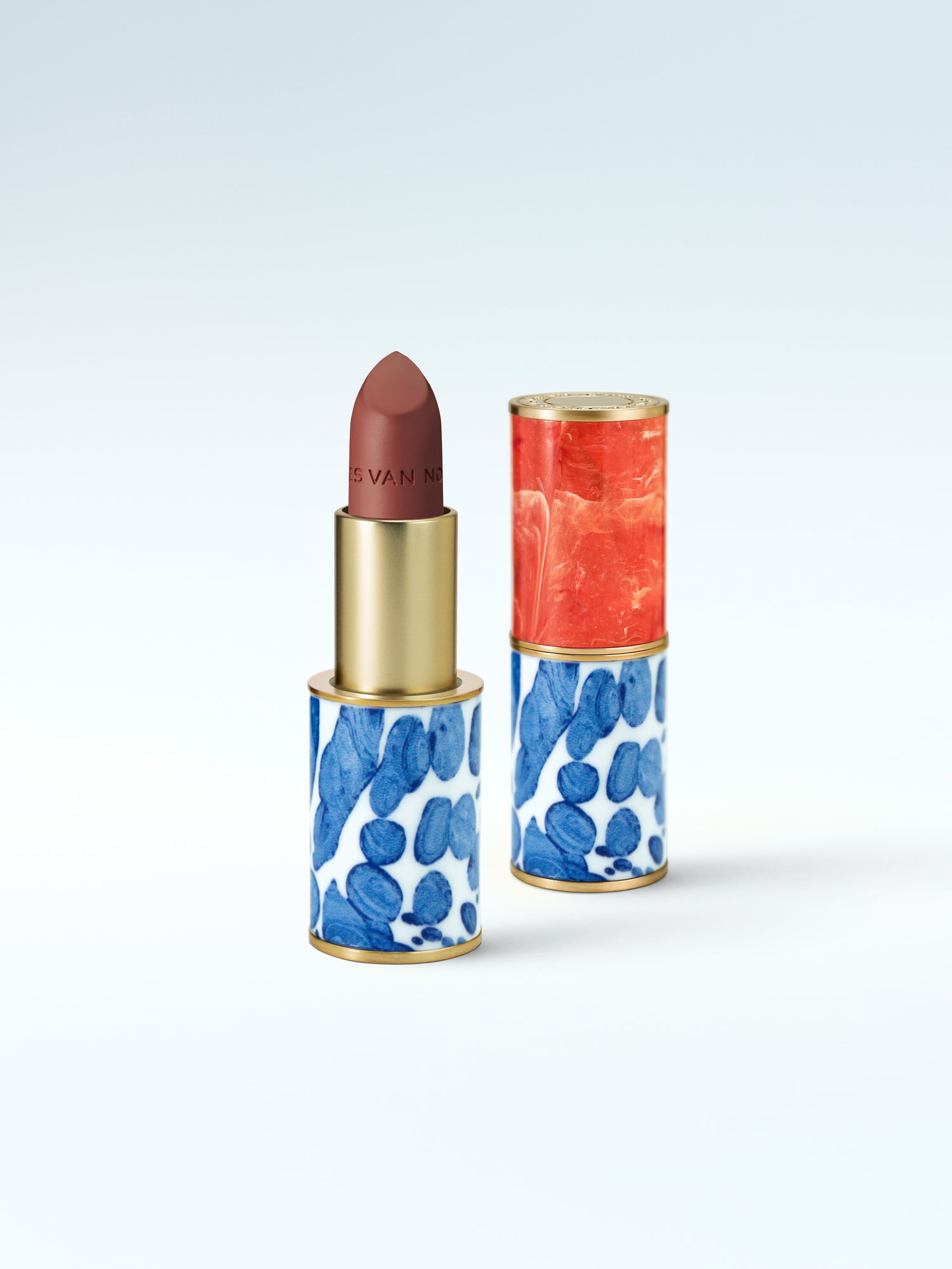 Lipstick with a case on a light blue background
