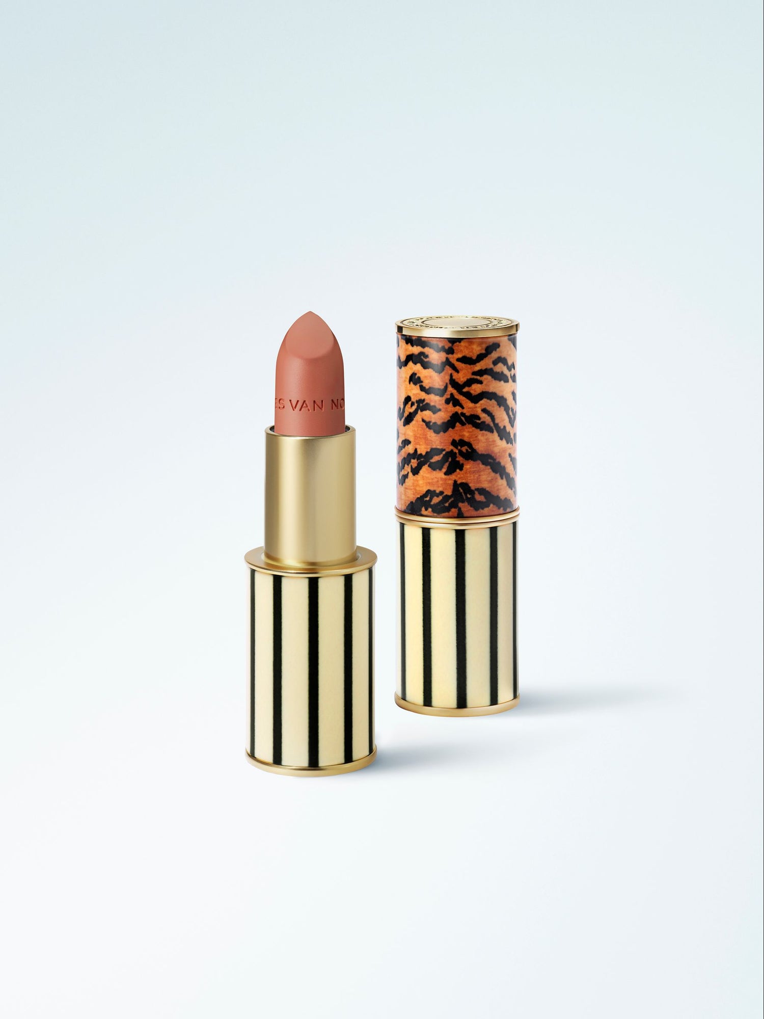 Lipstick with a decorative case on a blue gradient background