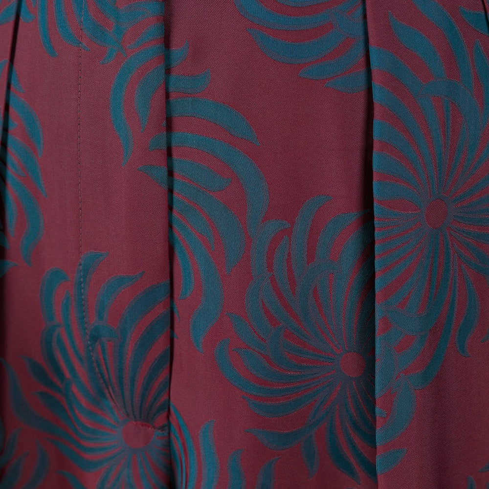 Red fabric with blue floral pattern