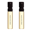 Two Dries Van Noten perfume samples on a white background